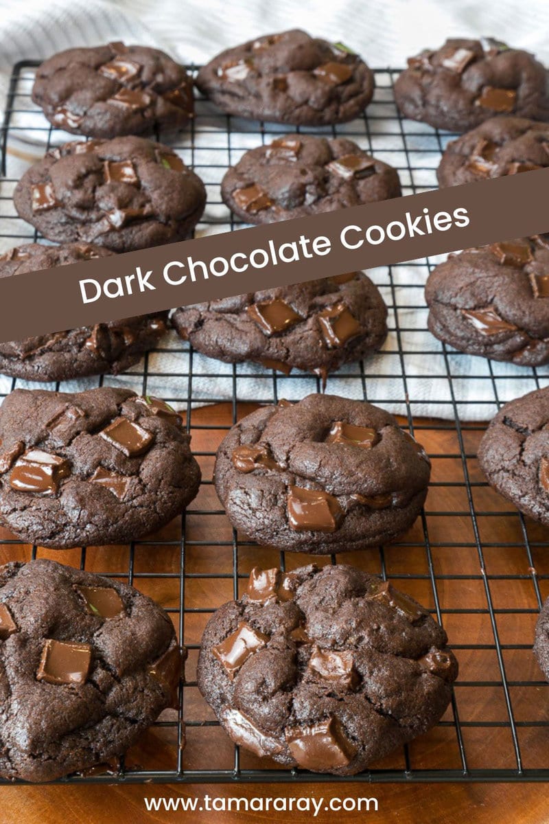 Dark chocolate cookies on a cooking rack.