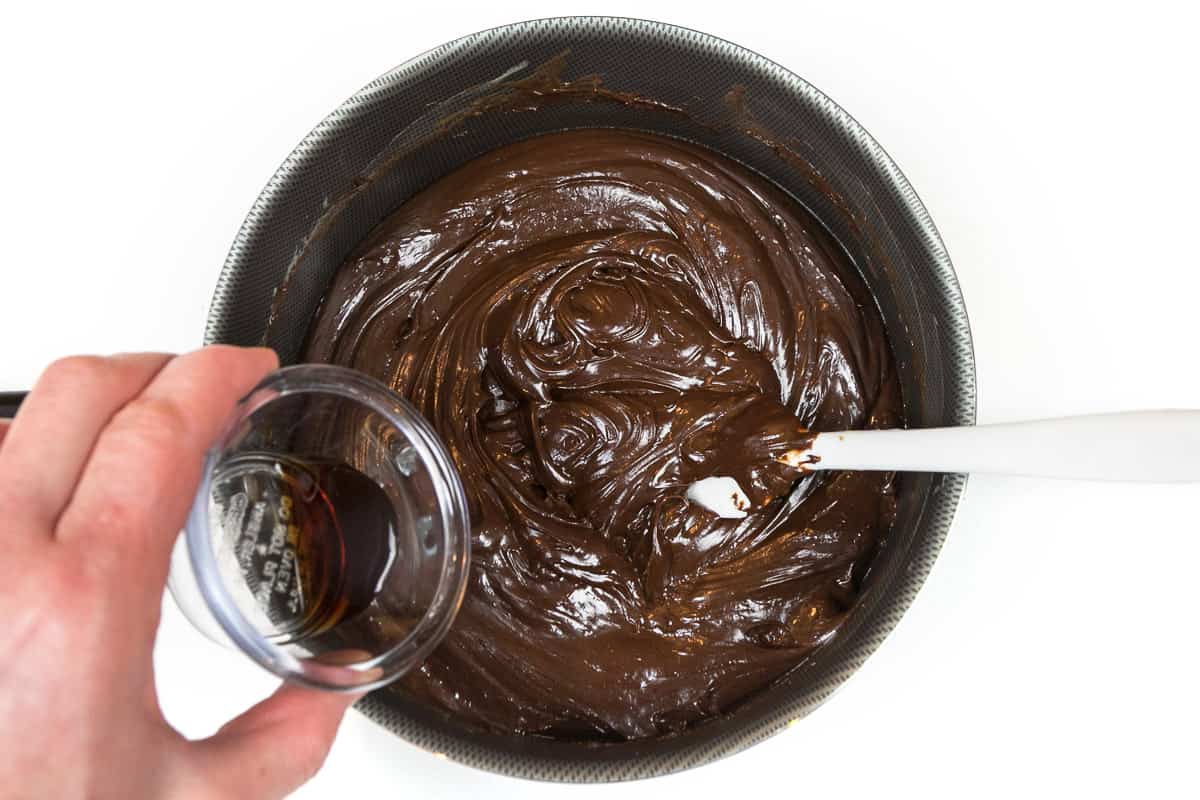 The vanilla extract is added to the fudge mixture.