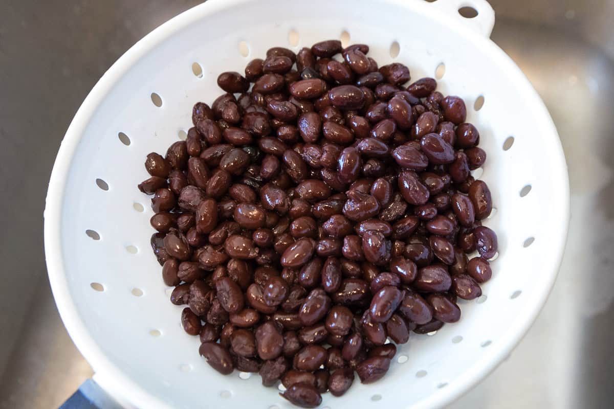 Black beans in a colander.