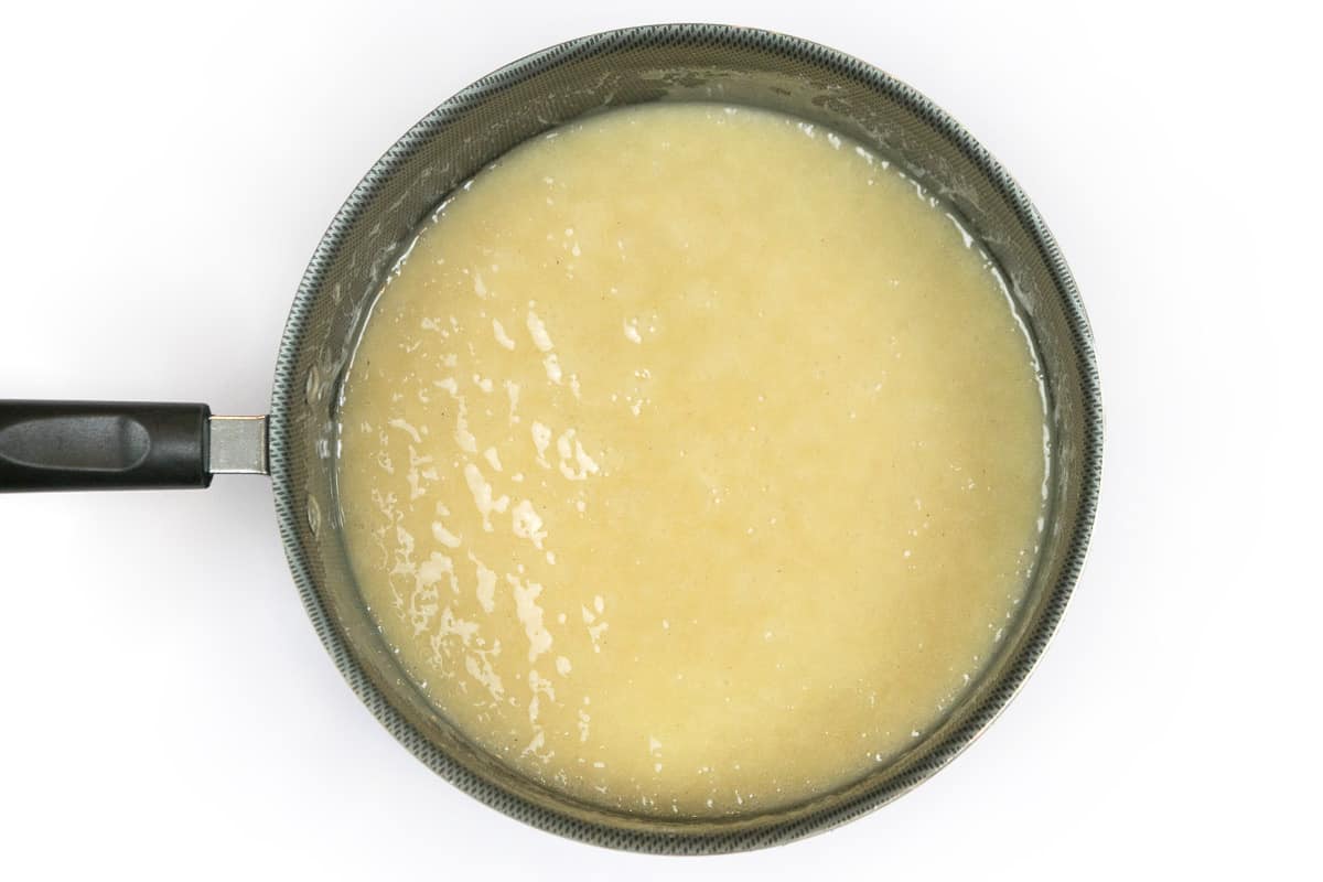 The butter, sugar, and evaporated milk in a rolling boil for five minutes in a saucepan.