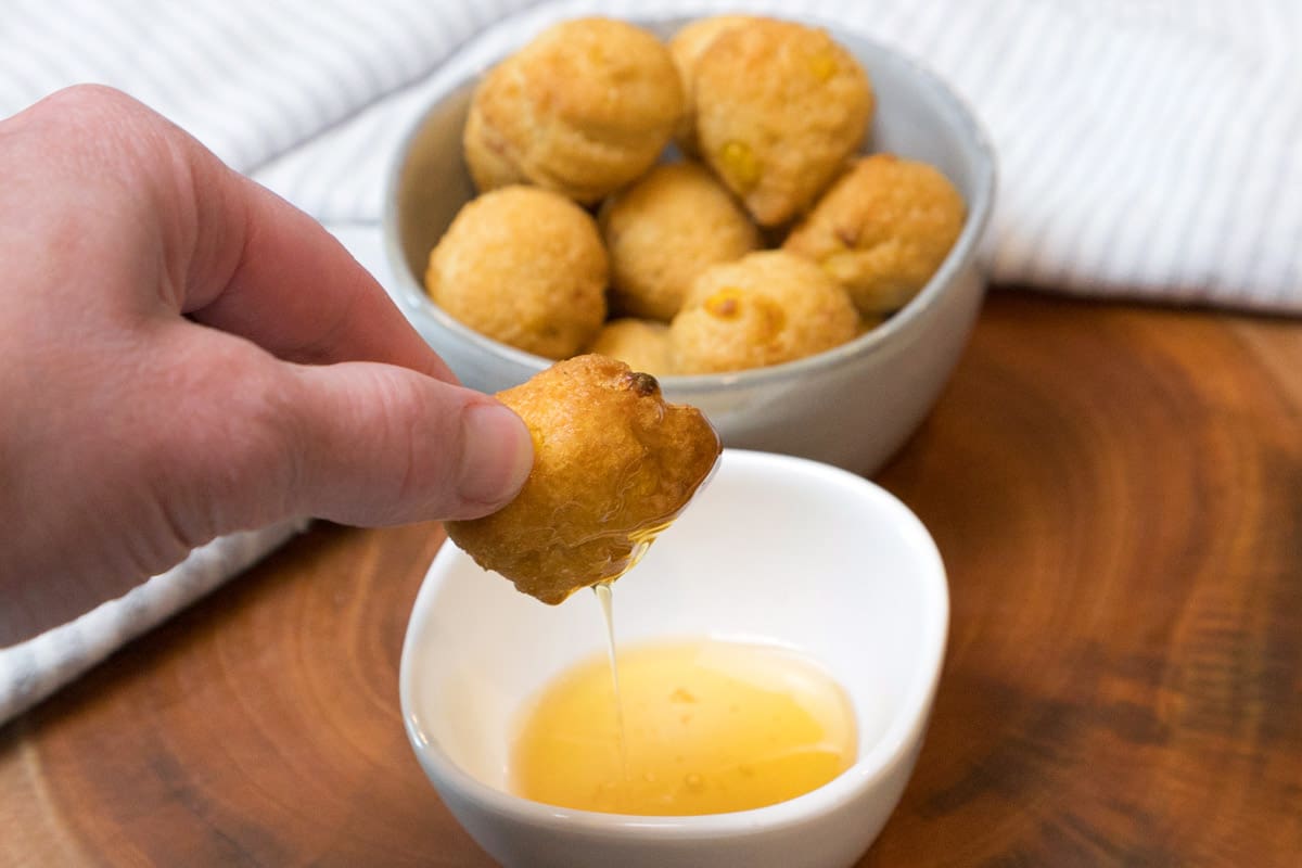 Crispy hush puppies in a bowl.
