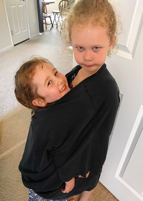 My two daughters trying out a homemade version of the get along shirt.