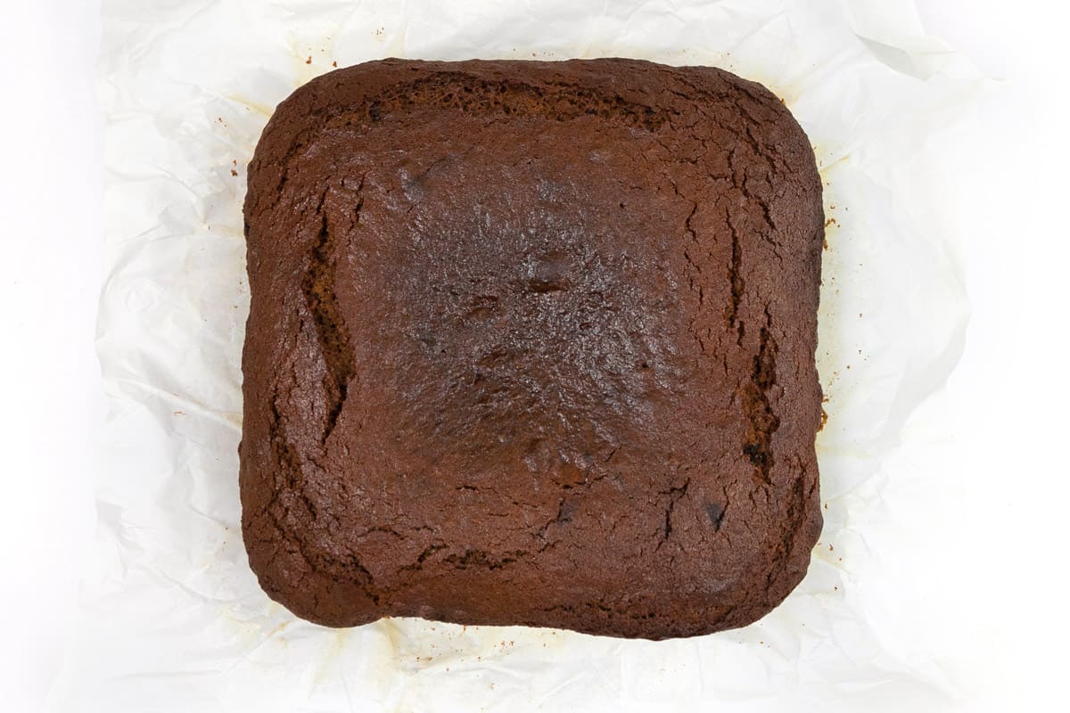 Bake gingerbread cake at three hundred and twenty-five degrees Fahrenheit for one and a half hours or until a toothpick inserted in the center of the cake comes out clean.