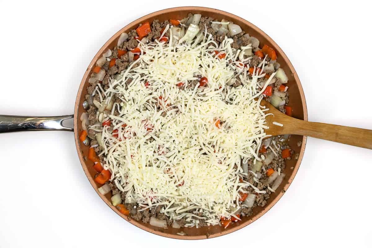 Italian blend shredded cheese is added to the ground beef mixture.