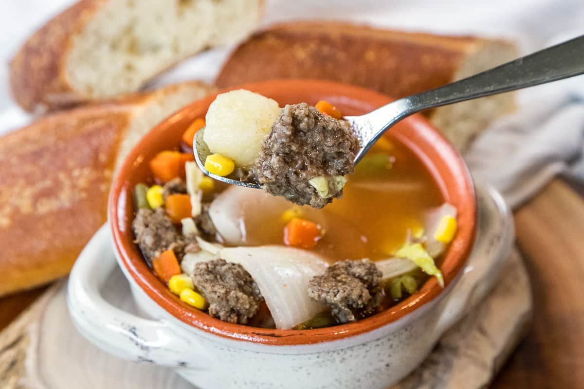 Hamburger soup with cabbage and potatoes in a bowl.