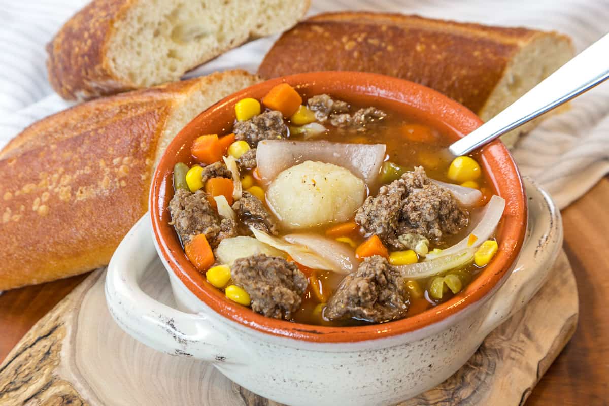 Hamburger soup with cabbage and potatoes in a bowl.