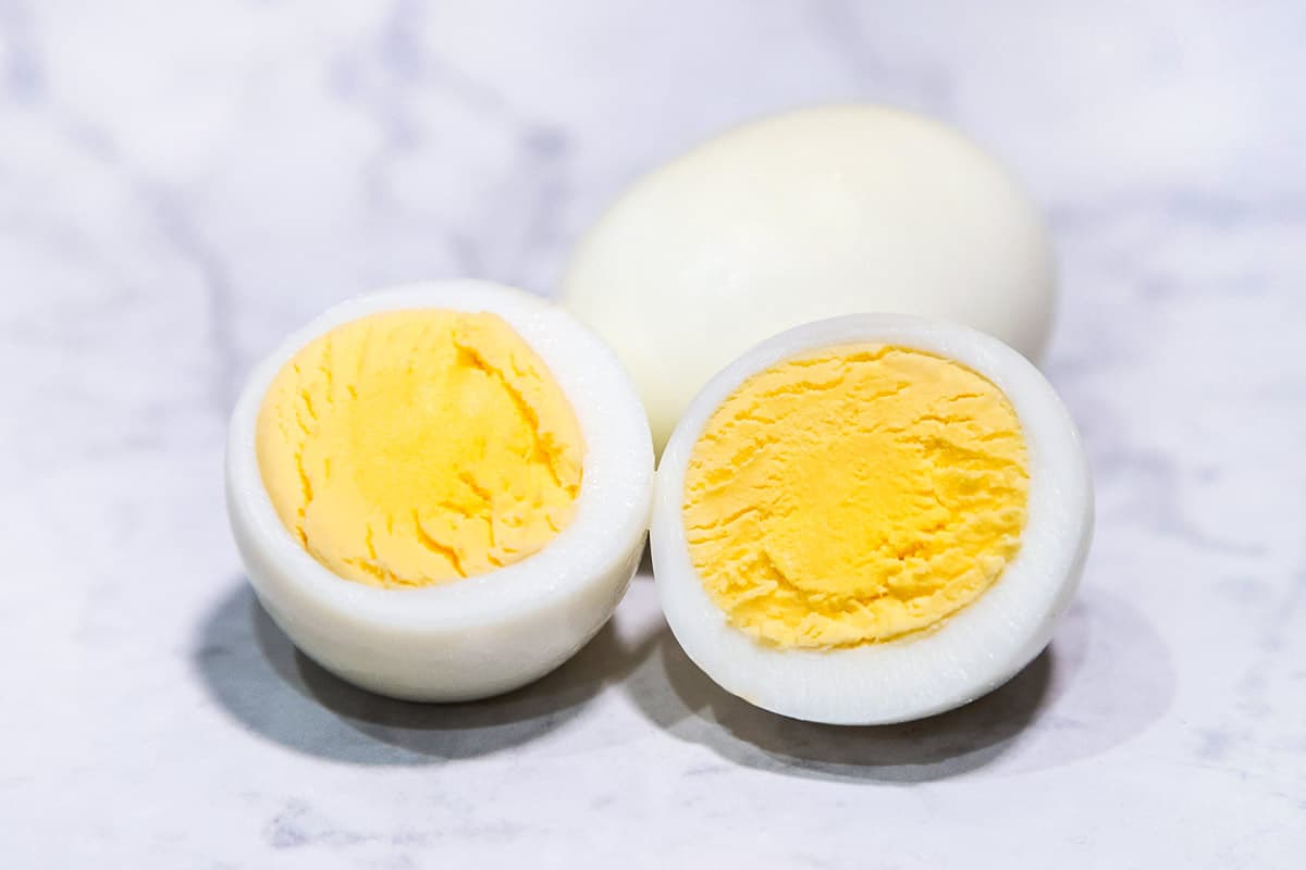 Perfect hard-boiled eggs baked in the oven in a muffin pan.