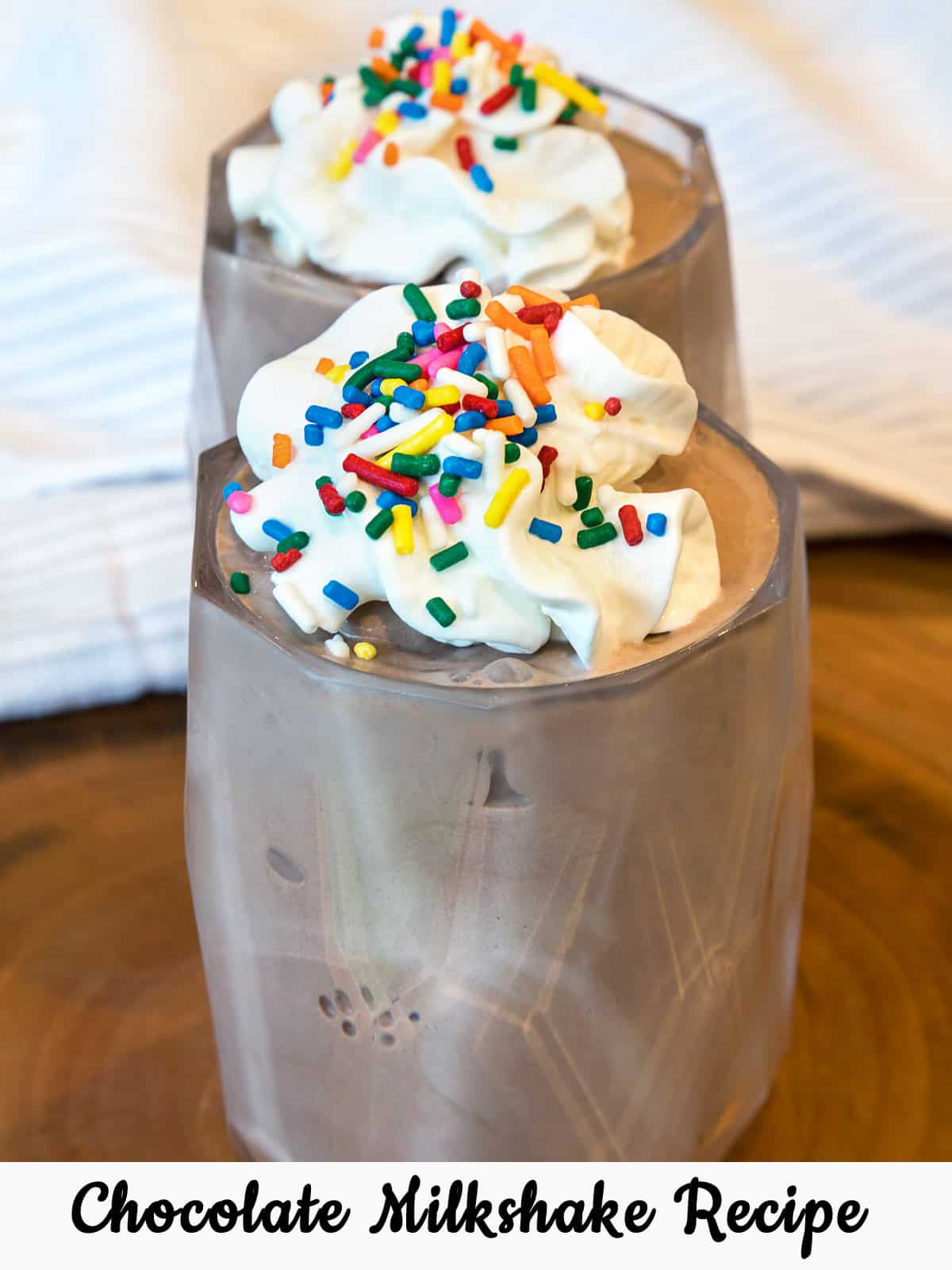 homemade chocolate milkshake with sprinkles on top.