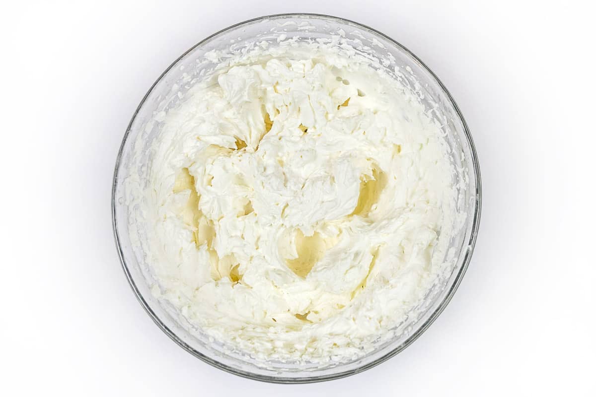 Beat for about five minutes on medium-high speed until soft stiff peaks form in the cream mixture.