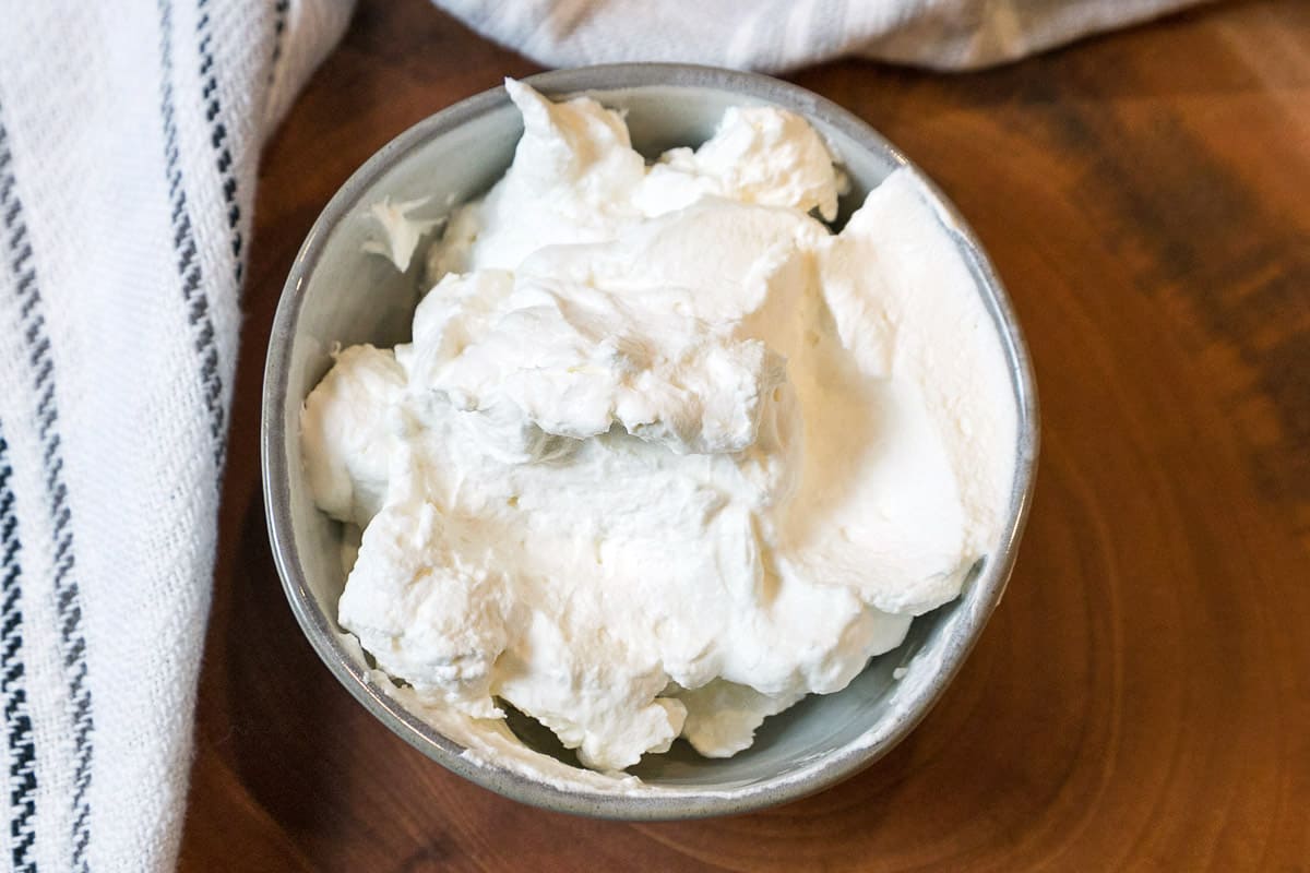 Homemade whipped cream in a bowl.