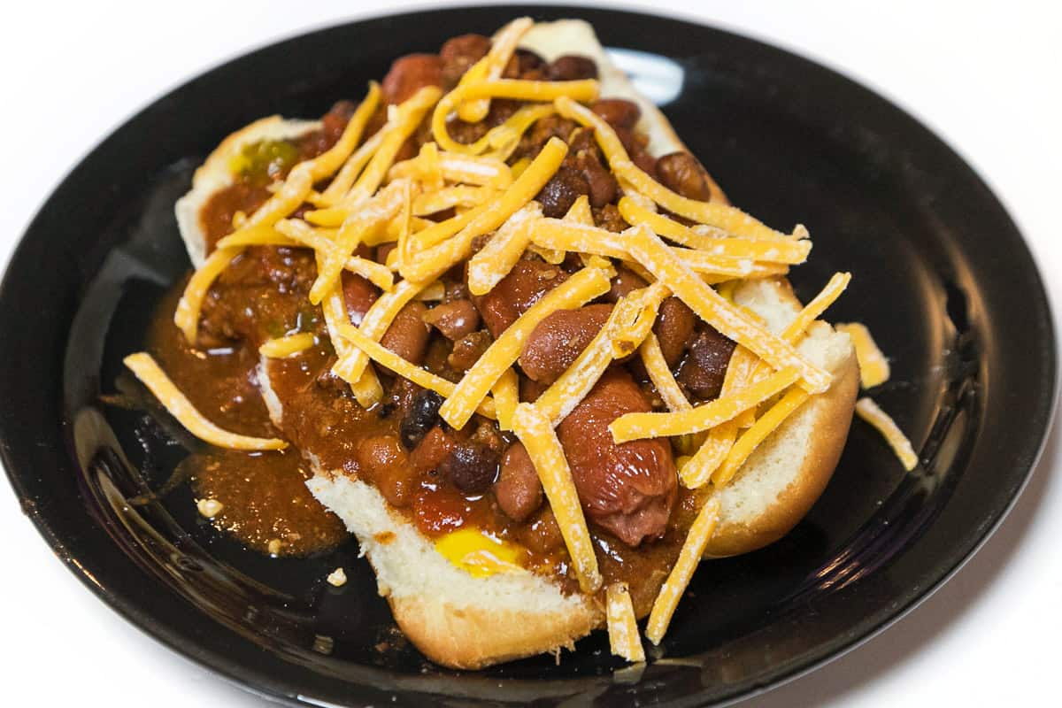 A chili dog on a plate.