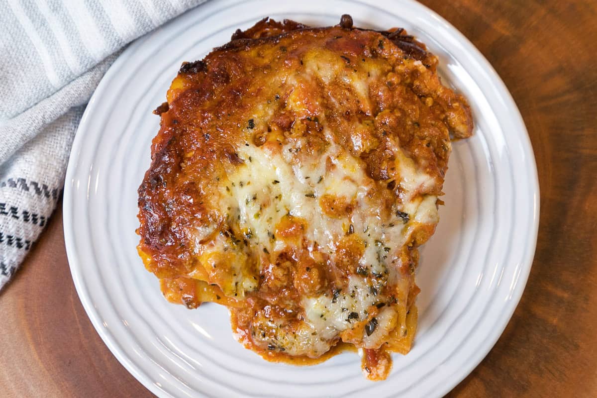 Cooked frozen lasagna on a plate.