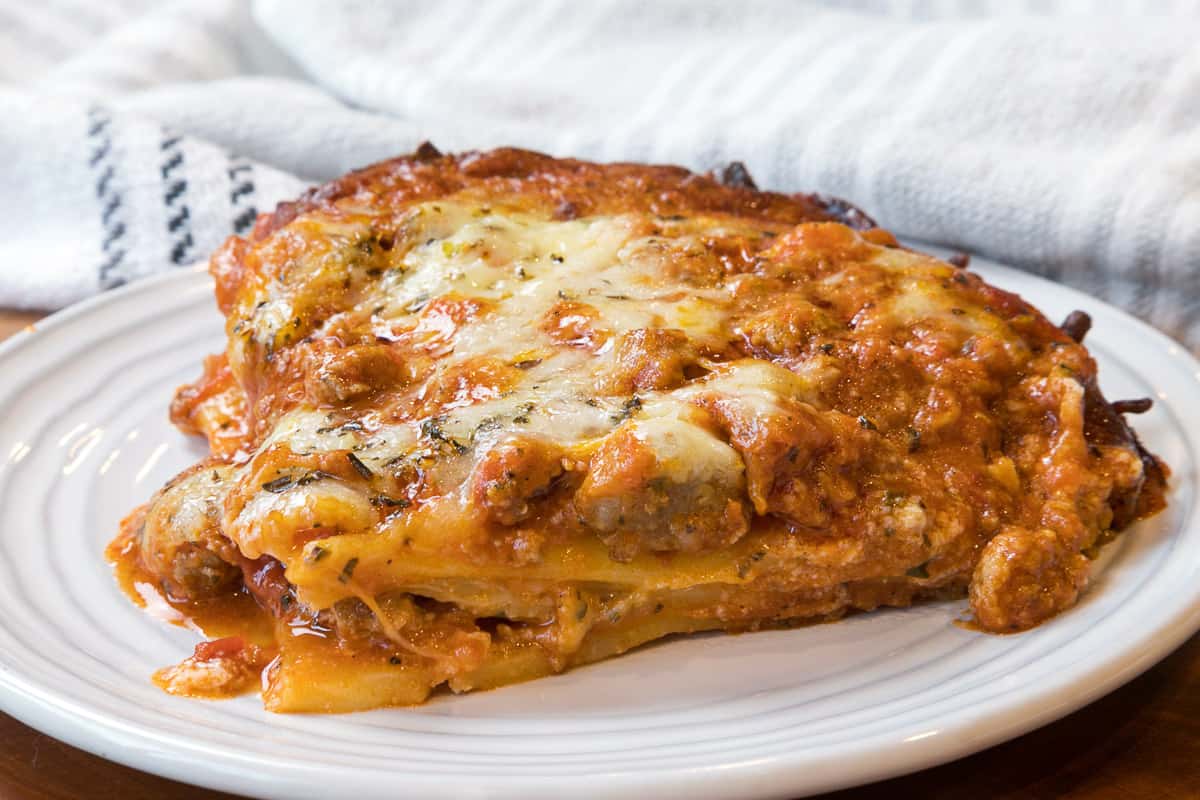 Cooked frozen lasagna on a plate.