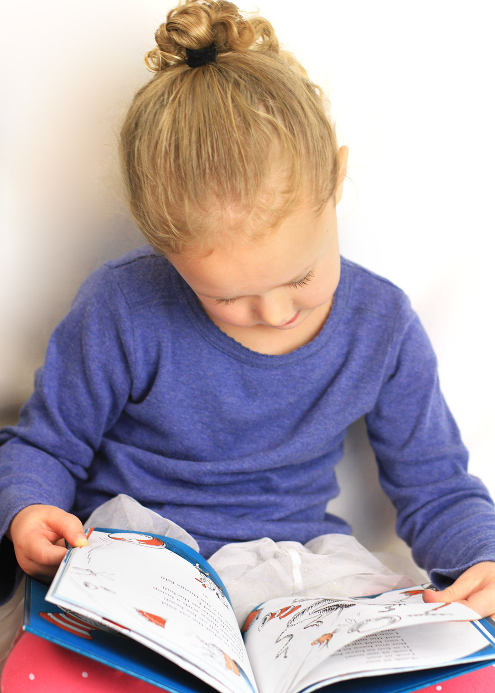 3 Year Old Reading Dr. Seuss.