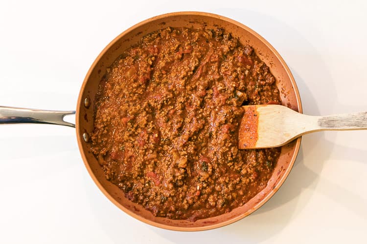 Thicken lean ground beef mixture in a frying pan.