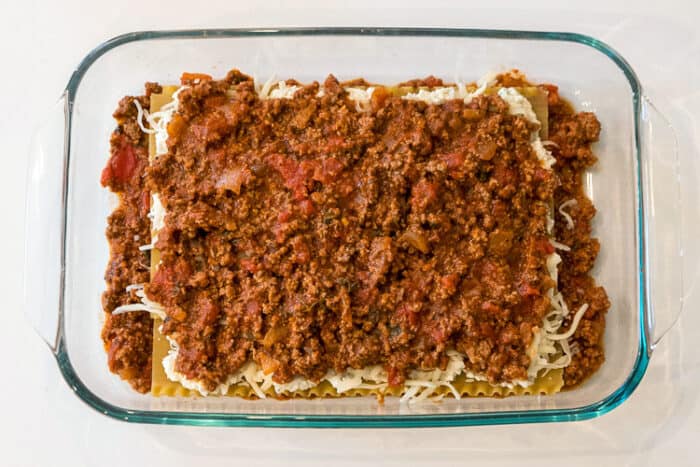 Another layer of ground beef over the mozzarella cheese.