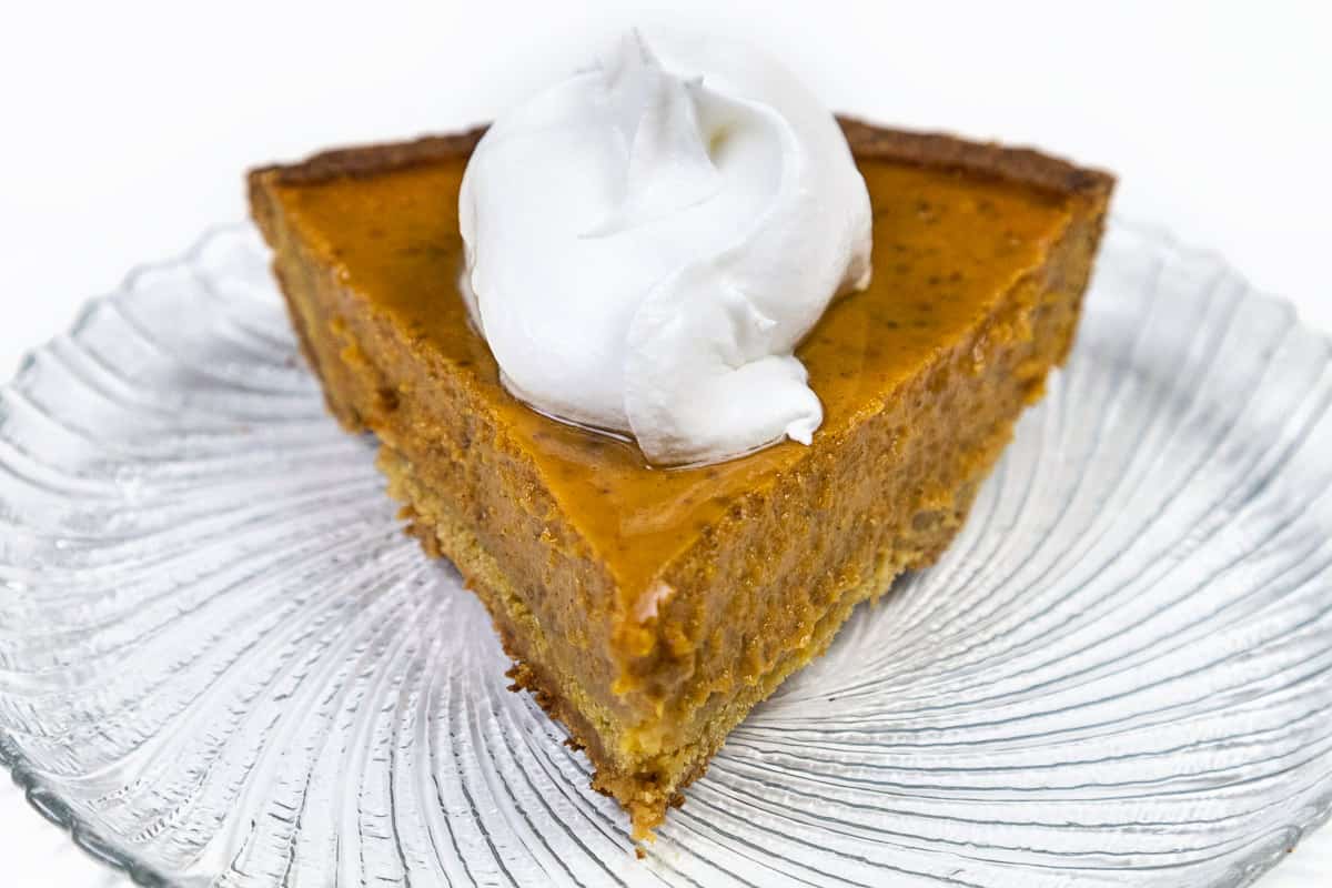 Libby's pumpkin pie with Cool Whip on a plate.