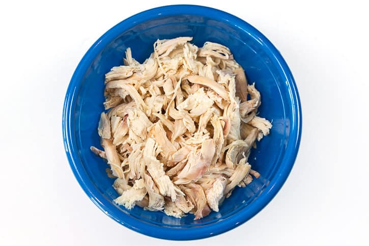 Shredded rotisserie chicken in a bowl.