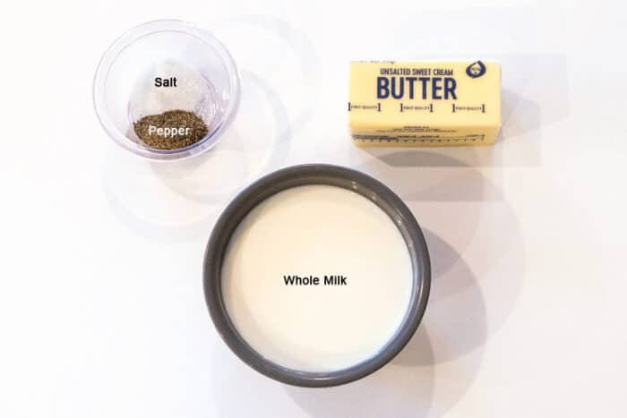 Ingredients for mashed potatoes, butter, whole milk, salt and pepper.