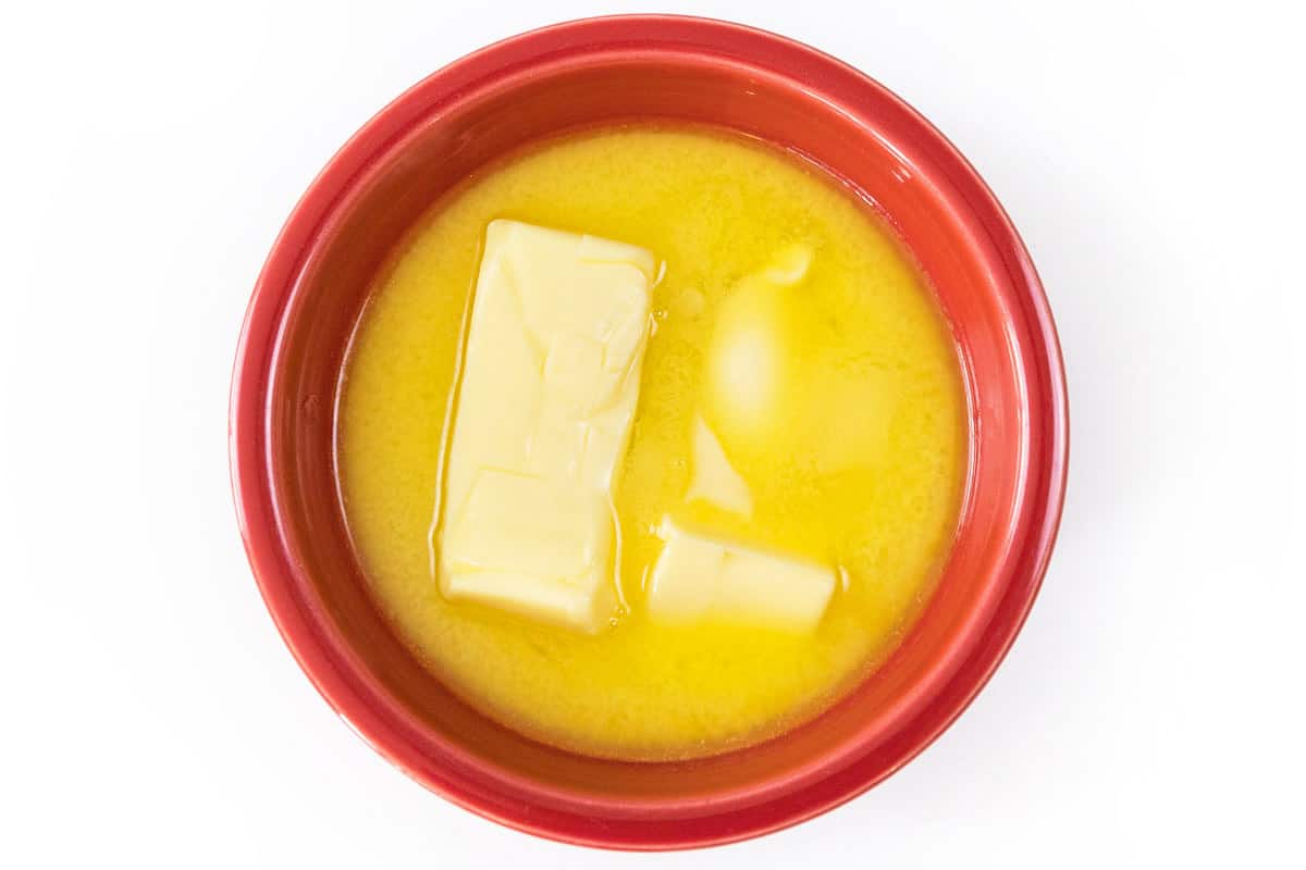 Melt three-fourths cup of butter in the microwave for thirty seconds.