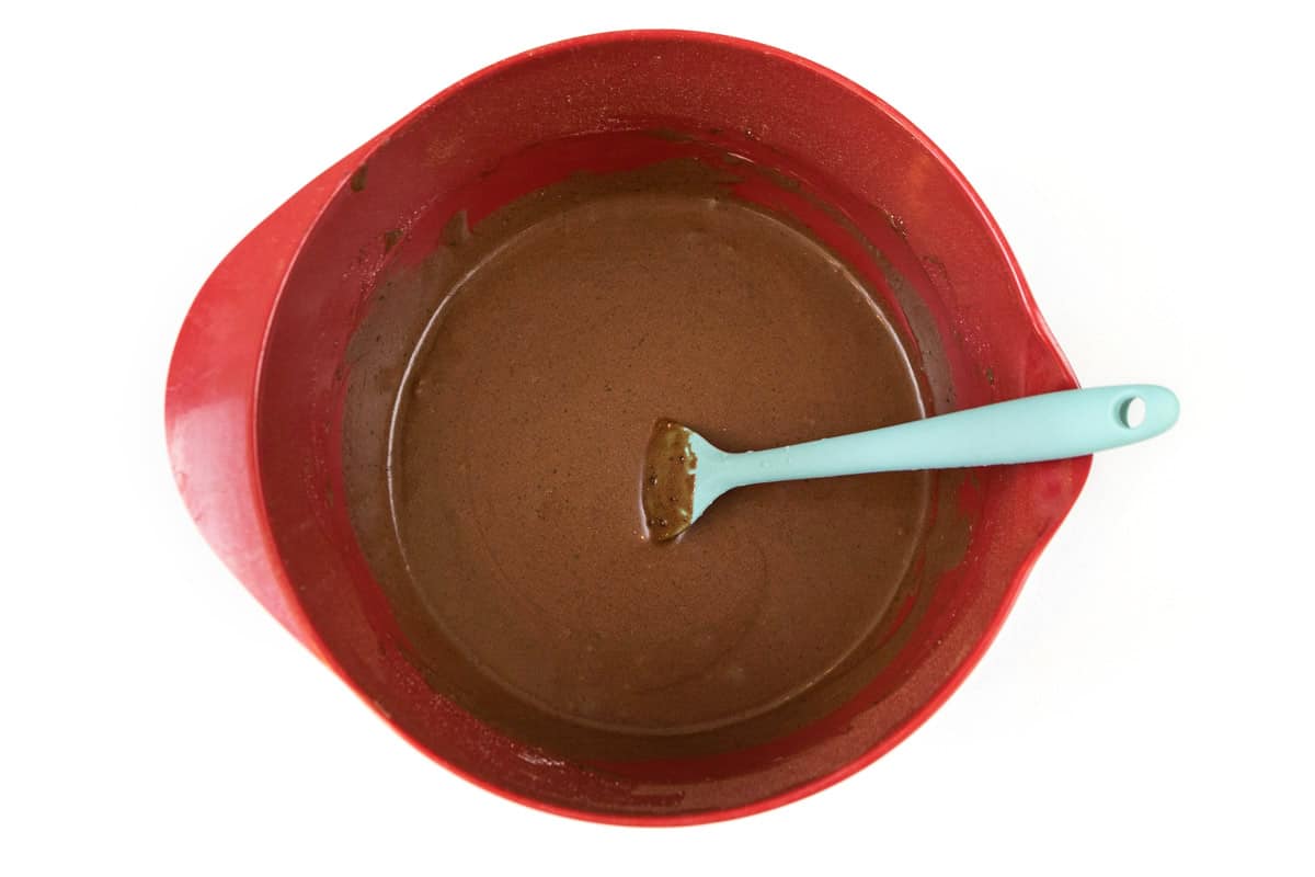 Mix the melted butter, powdered sugar, milk, and unsweetened cocoa powder thoroughly.