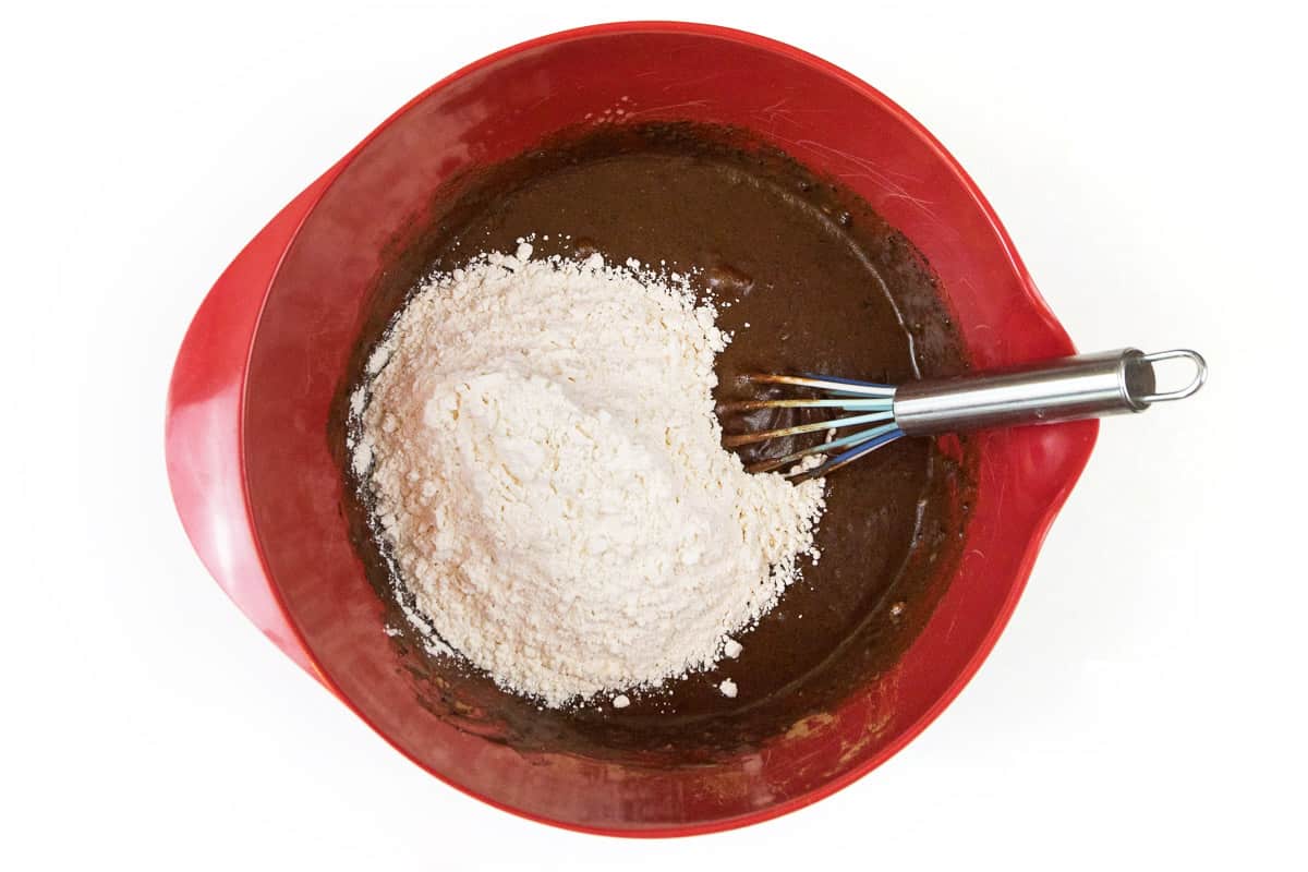 Slowly add one and one-half cups of flour to the chocolate mixture.