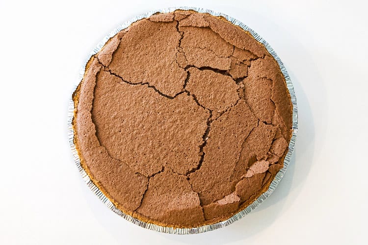 The Mississippi mud pie is baked at three hundred and twenty-five degrees Fahrenheit for forty-five minutes.