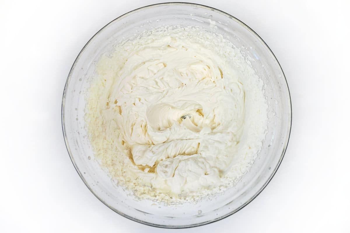 Beat the whipping cream mixture until stiff peaks form.