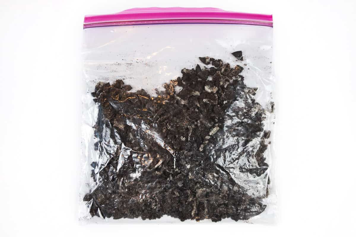 Crushed up Oreos in a zip lock bag.