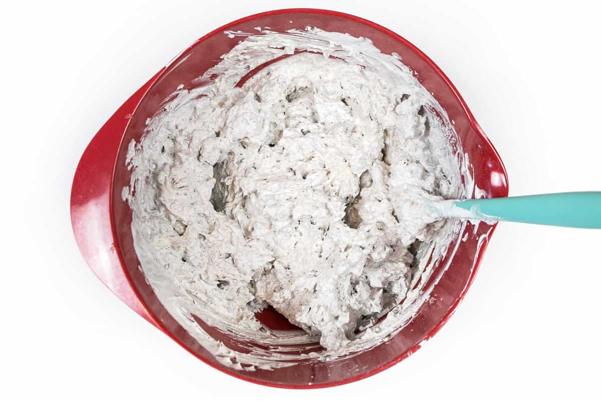 Mix the cream cheese mixture, whipped topping, and Oreo cookie crumbs thoroughly.