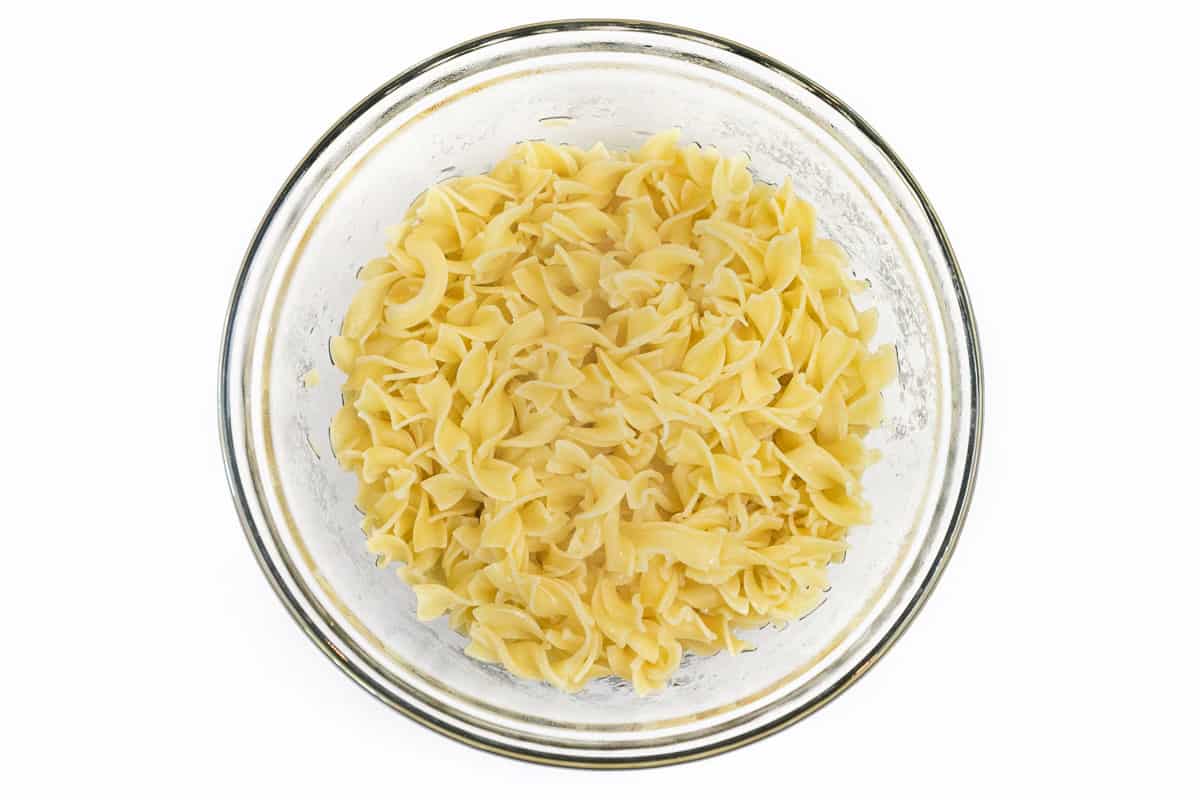 Cooked egg noodles in a bowl.
