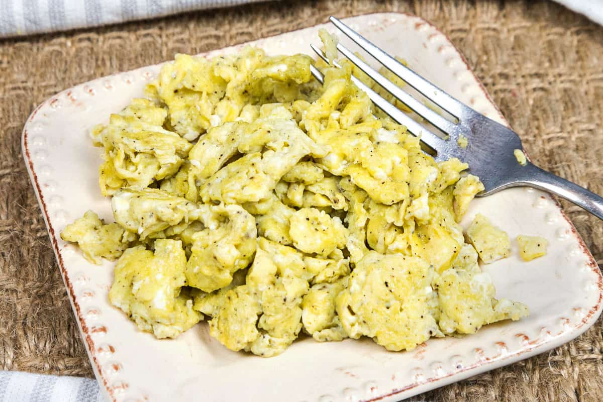 Olive Oil Scrambled Eggs made without milk on a plate.