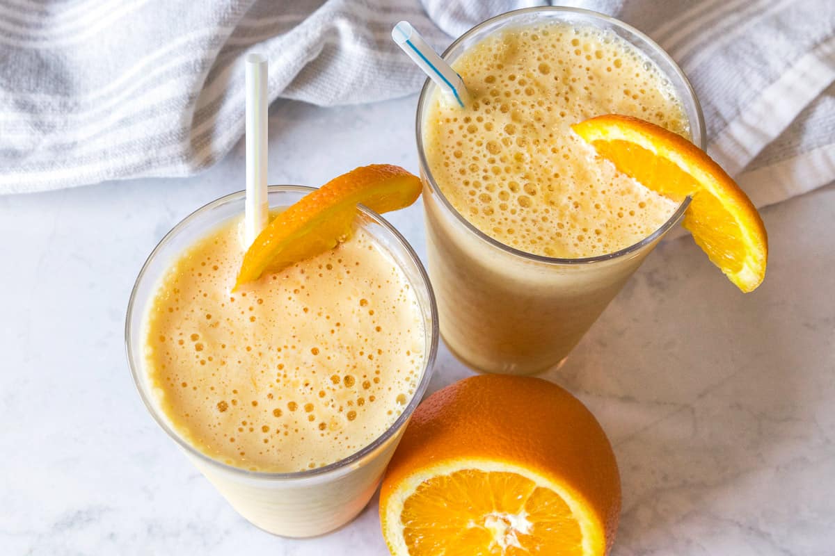 Copycat Orange Julius drink with orange slices.