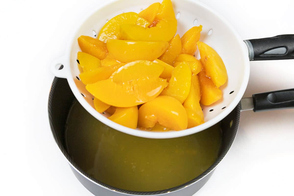 Drain the peach juice into a saucepan.