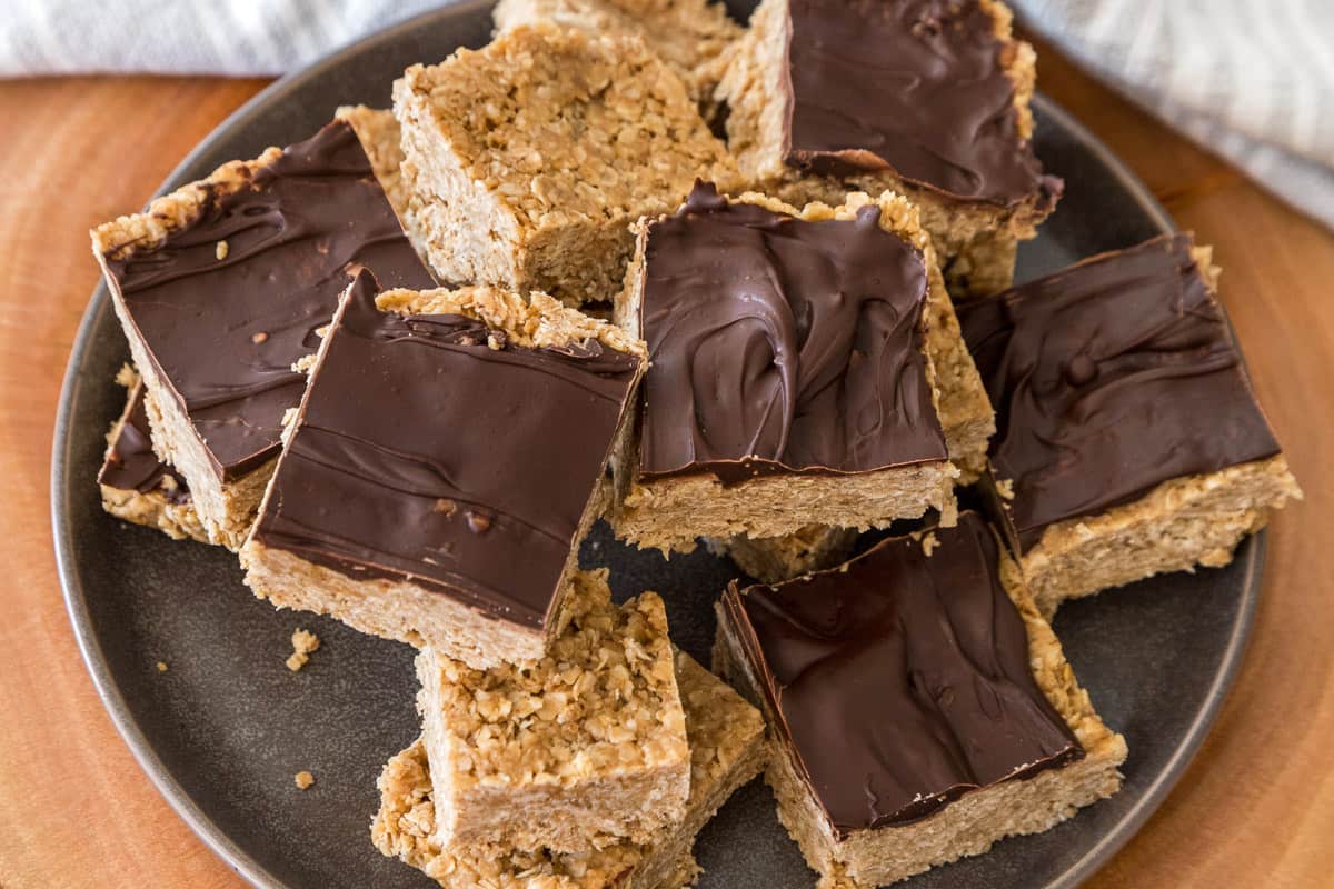 Peanut butter bars with oatmeal on a plate.