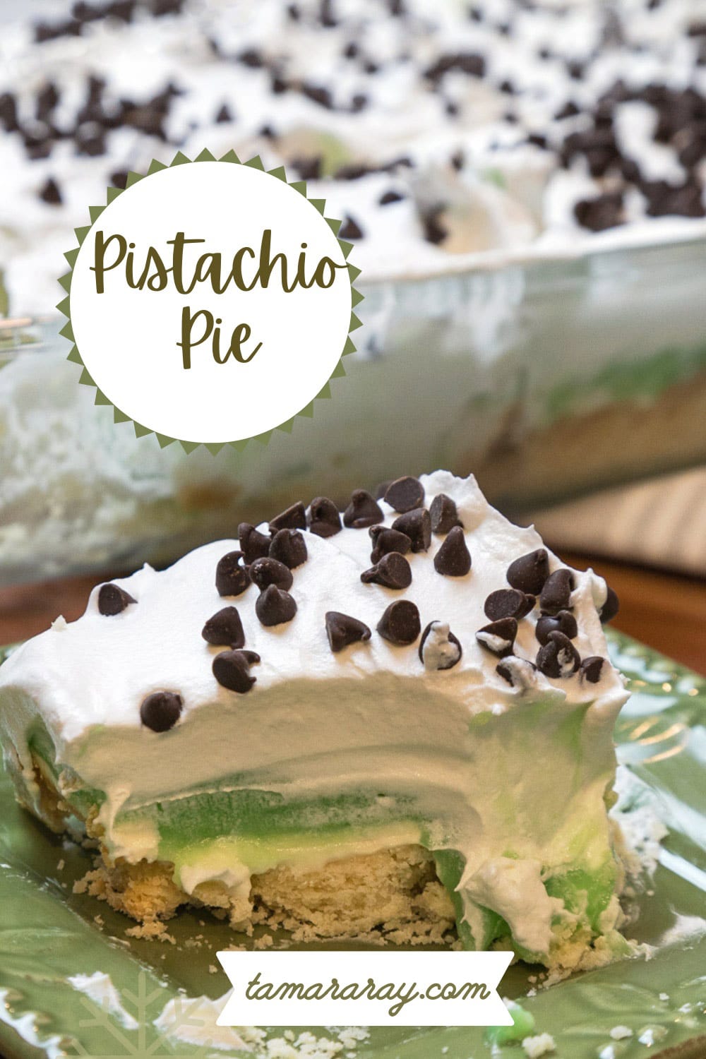 A slice of layered pistachio pudding dessert on a plate.
