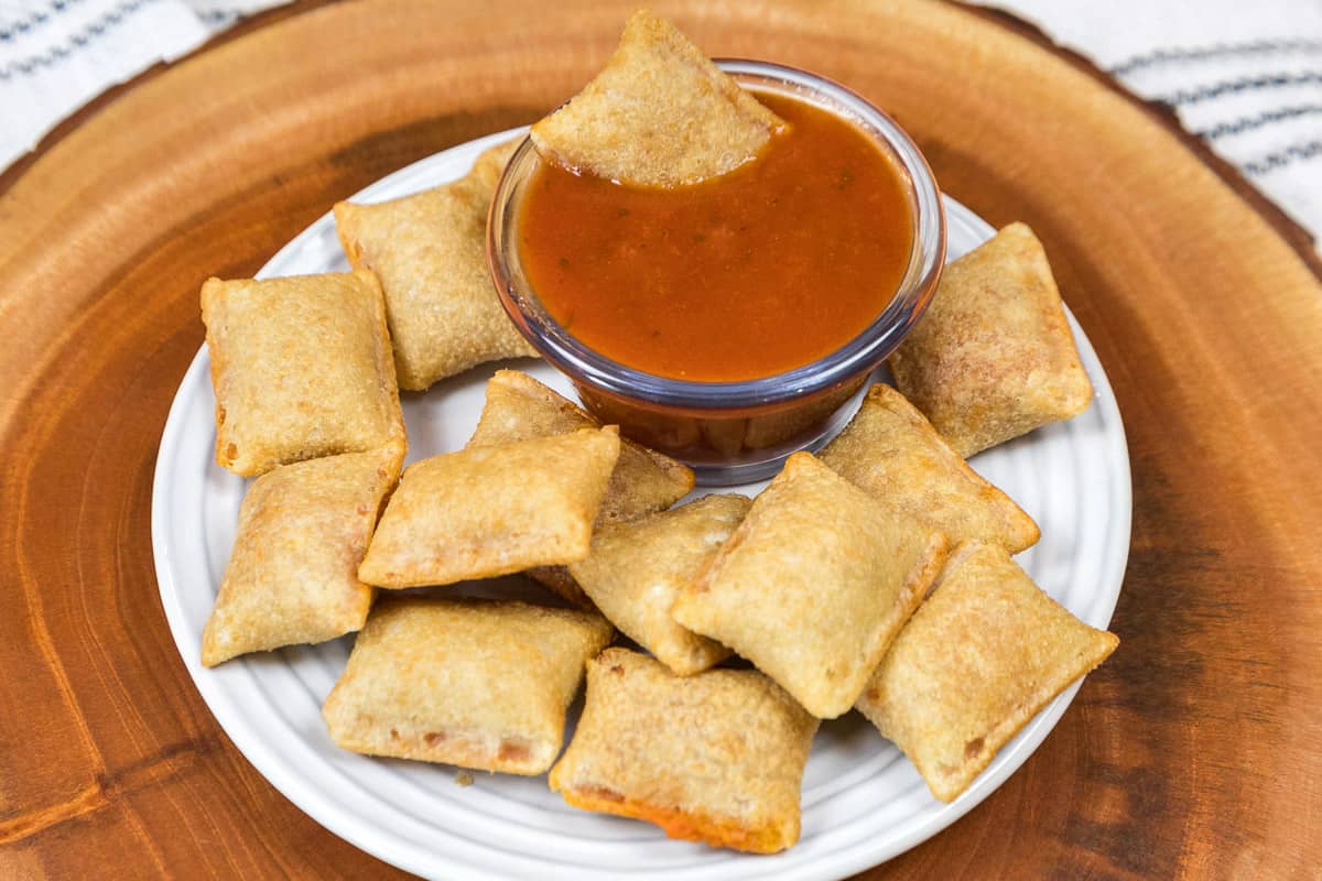 Totino's on a plate with dipping sauce.