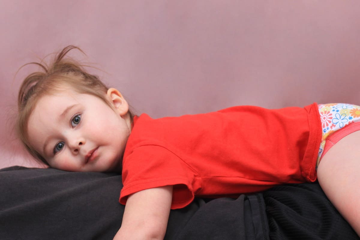 Toddler laying down.