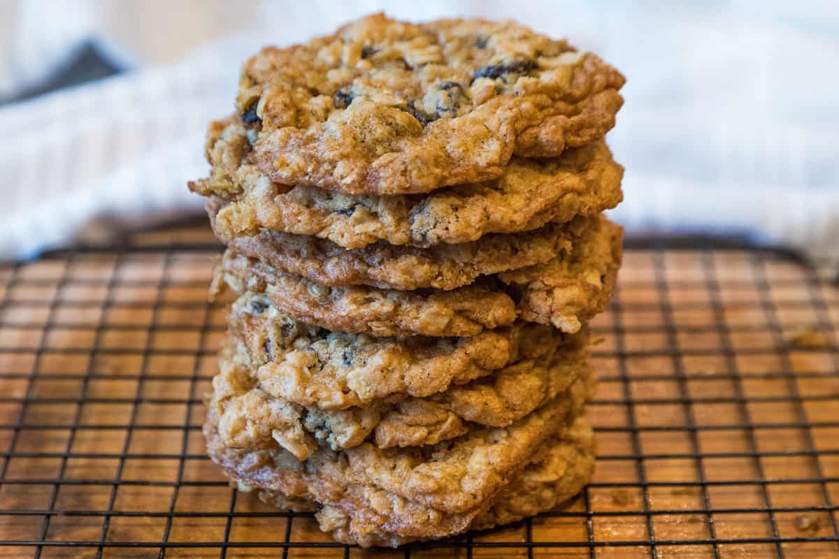 A stack of ranger cookies on a wire rack.