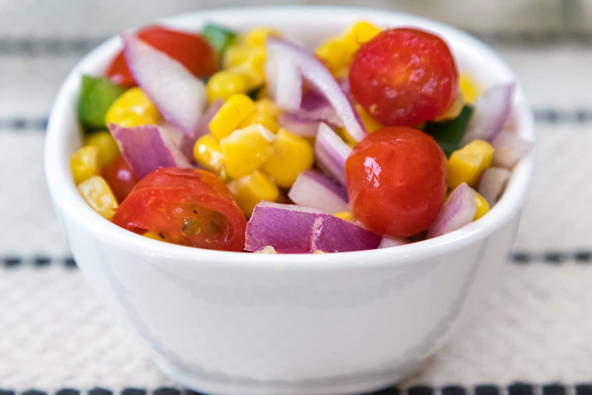 Roasted corn salsa in a small bowl.