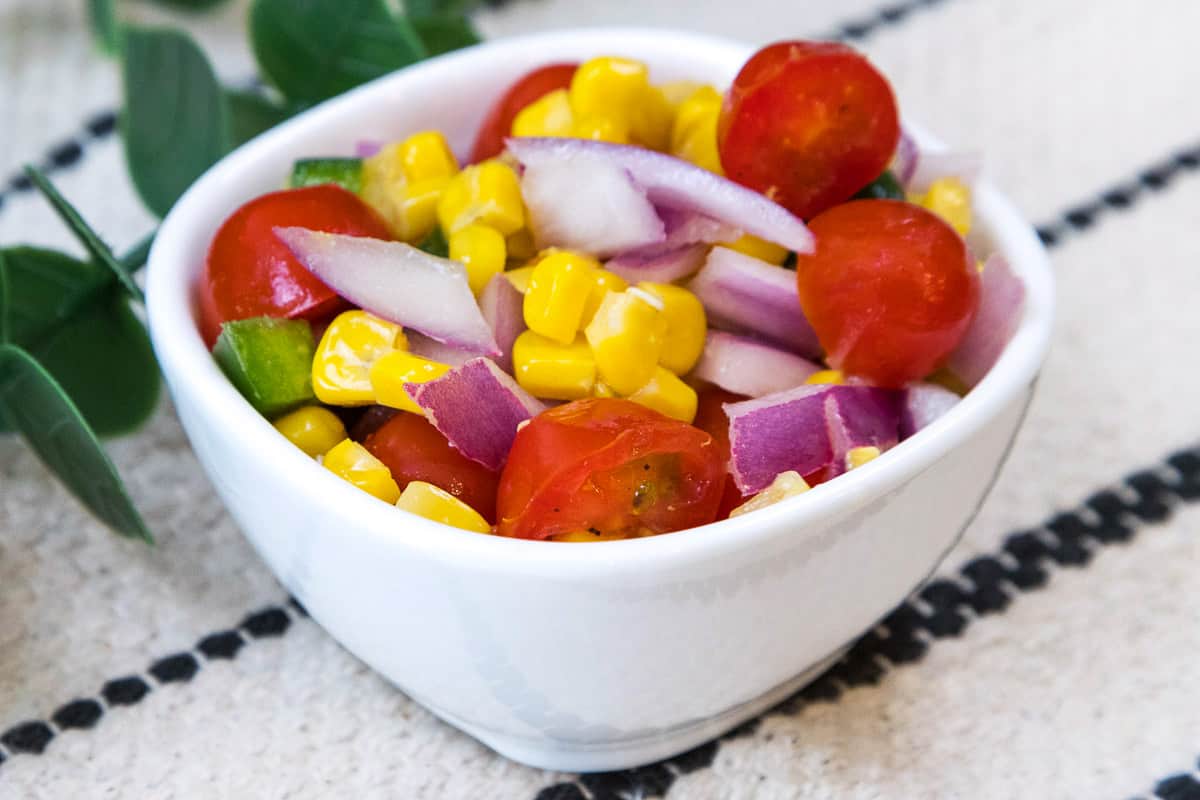 Roasted corn salsa in a small bowl.