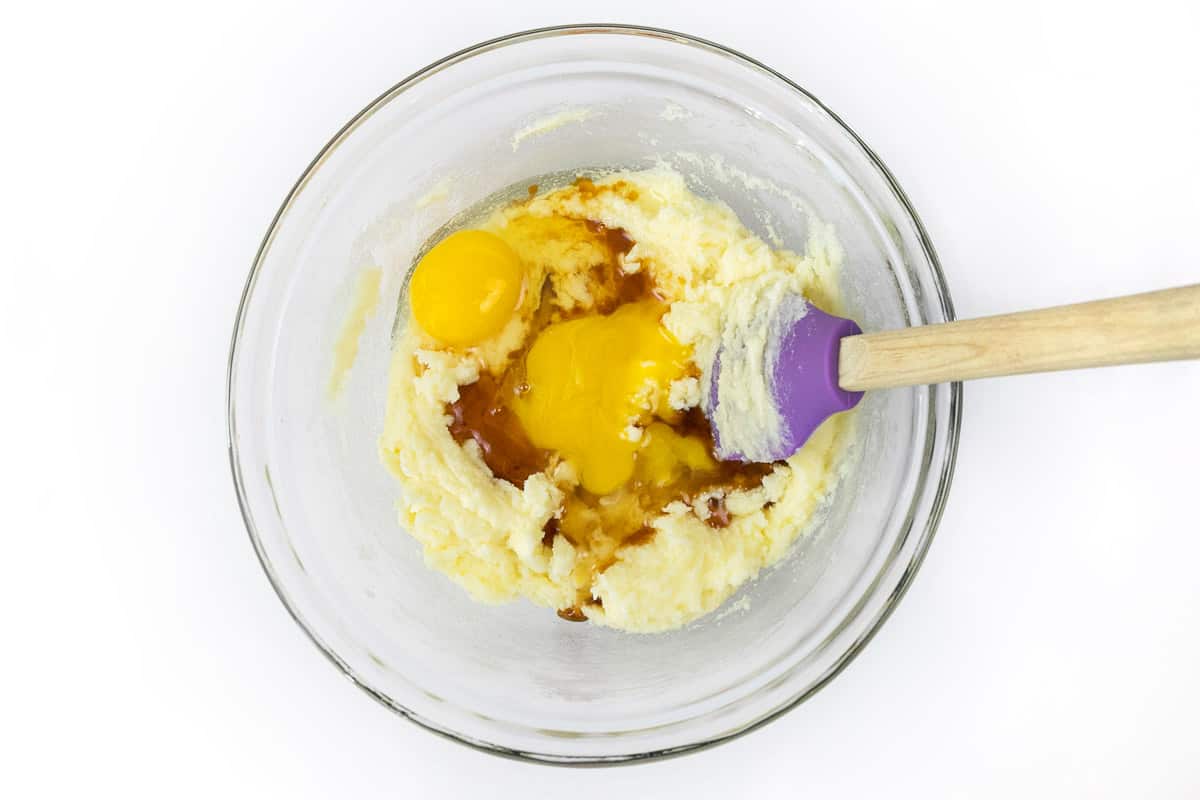 Add the eggs and vanilla extract to the sugar and butter mixture.