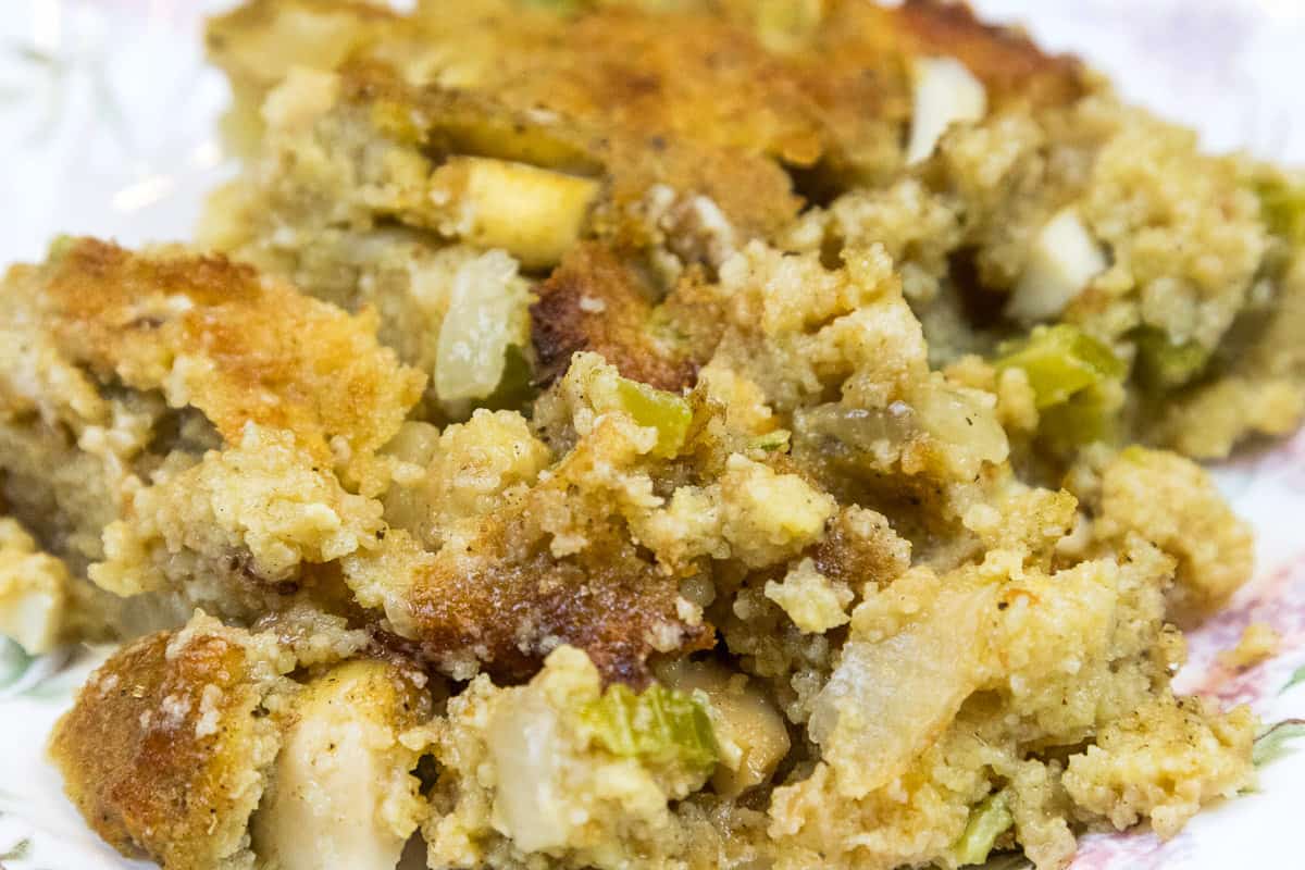 Cornbread dressing on a plate.