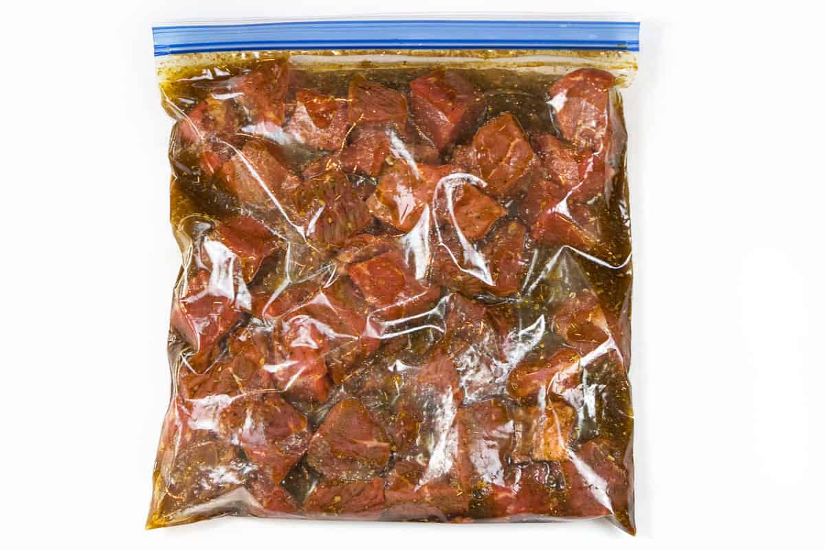 Steak added to the marinade in a zip lock bag.