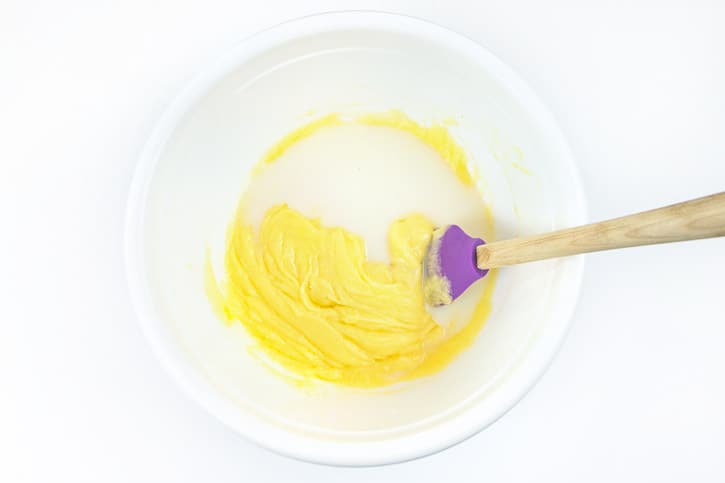 Milk and vanilla extract is added to the melted butter, sugar, and eggs.