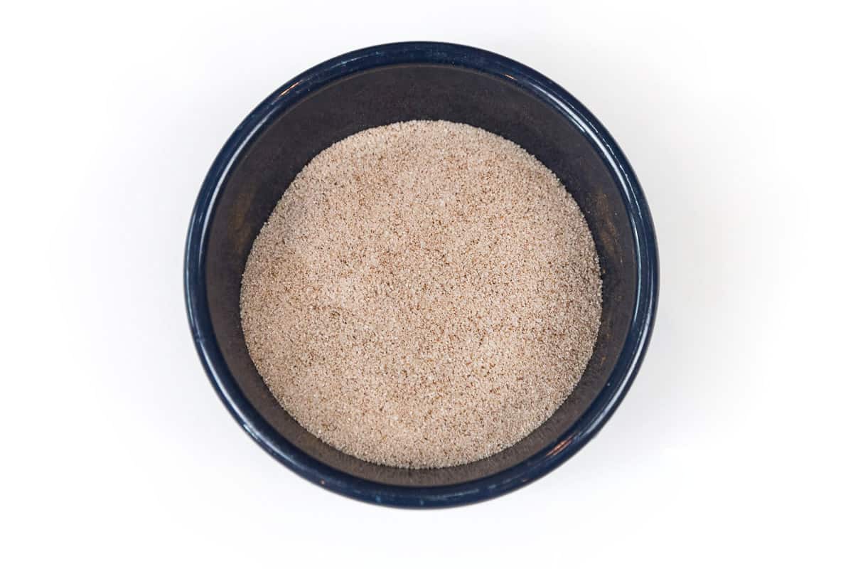 Ground cinnamon and granulated sugar in a bowl.