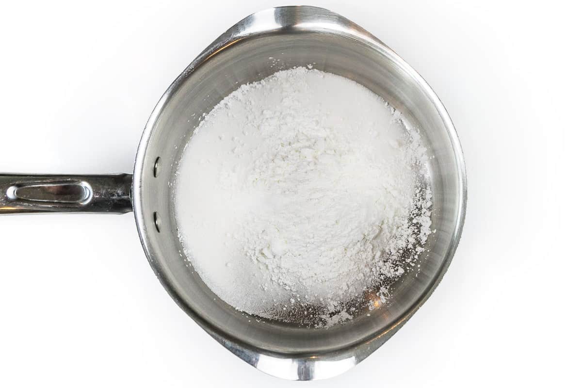 Cornstarch, granulated sugar, and a pinch of salt in a saucepan.