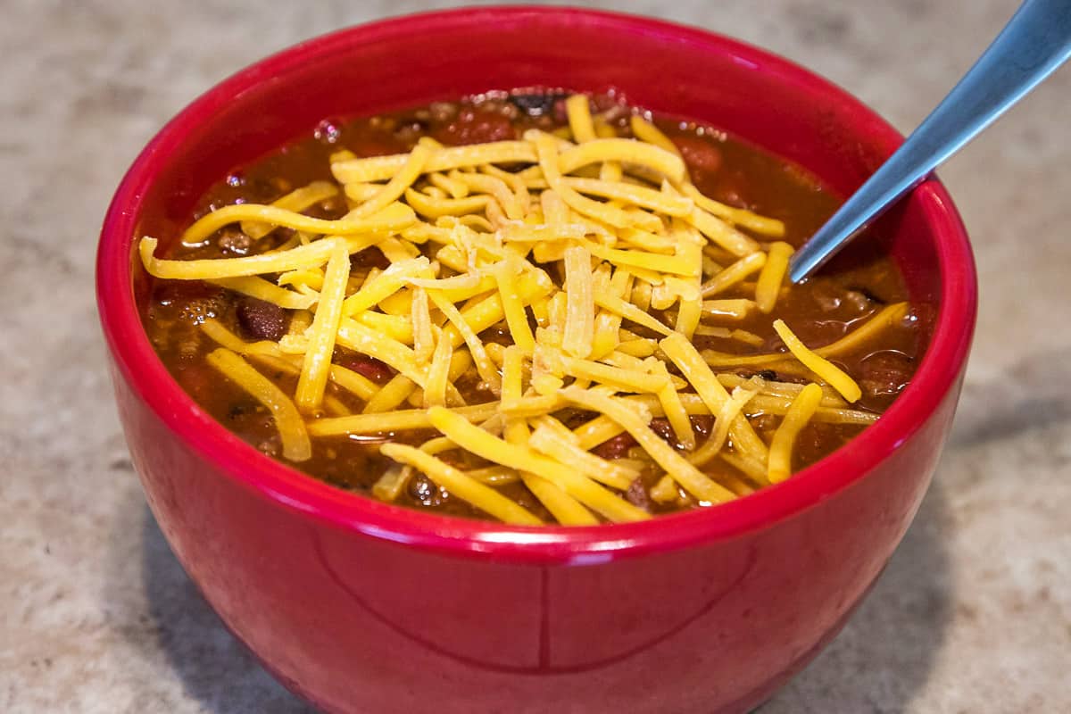 Chili Instant Pot Final Dish with cheddar cheese on top.